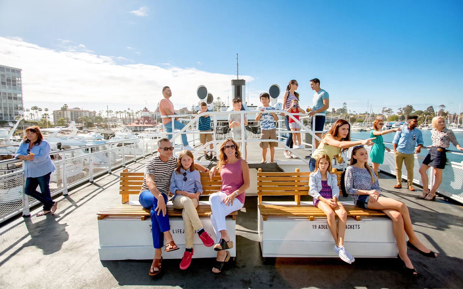 Guests enjoying the San Diego Whale & Dolphin Watching Adventure Cruise on a sunny day.
