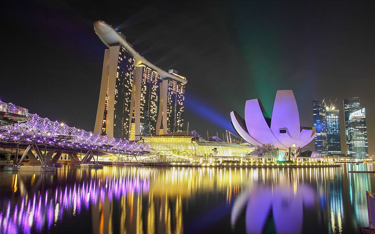 Marina Bay Sands and Helix Bridge illuminated at night, Singapore.