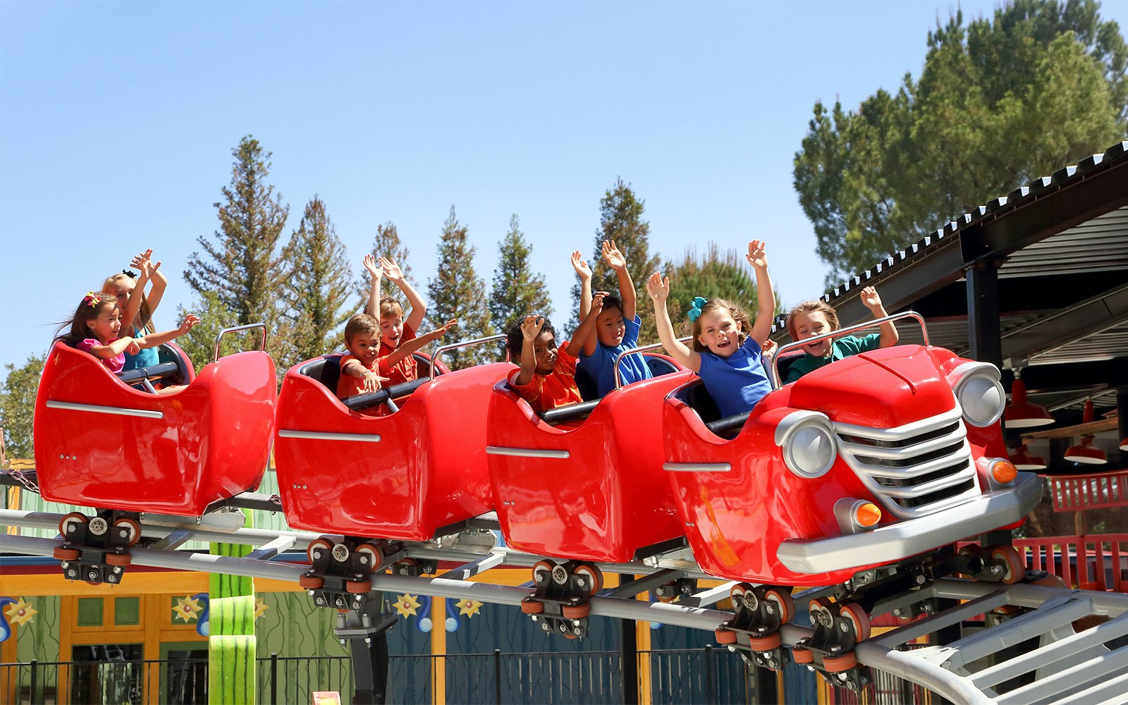 Children enjoying Speedy Gonzales Hot Rod Racers ride at Six Flags Magic Mountain.