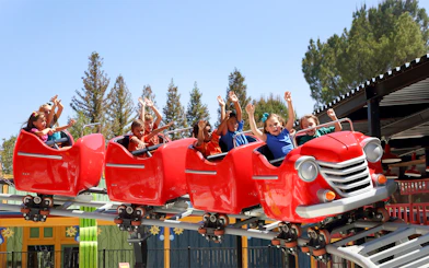 Children enjoying Speedy Gonzales Hot Rod Racers ride at Six Flags Magic Mountain.