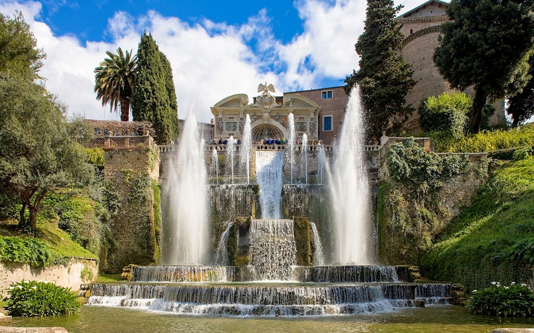 Fountains and gardens at Villa d'Este in Tivoli, Italy, with cascading water and lush greenery.