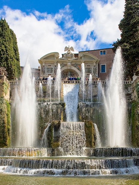 Fountains and gardens at Villa d'Este in Tivoli, Italy, with cascading water and lush greenery.