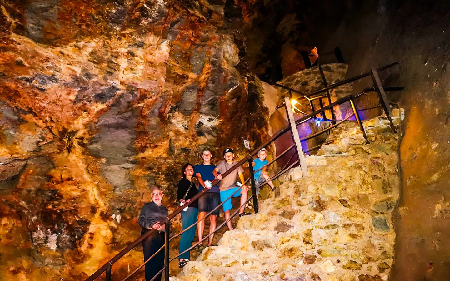 Visitors exploring a cave on the Cuernavaca and Taxco day tour from Mexico City.