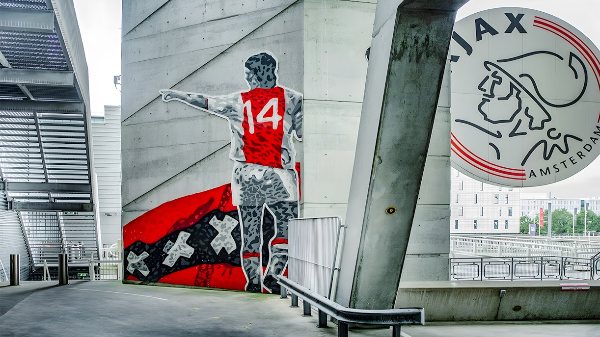 Mural of a football player with number 14 at Johan Cruijff ArenA, Amsterdam.
