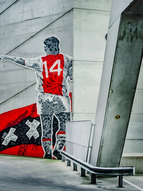 Mural of a football player with number 14 at Johan Cruijff ArenA, Amsterdam.