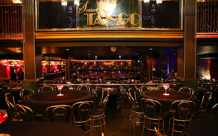 Dining area at Señor Tango Show with tables and stage in Buenos Aires.