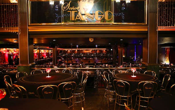 Dining area at Señor Tango Show with tables and stage in Buenos Aires.