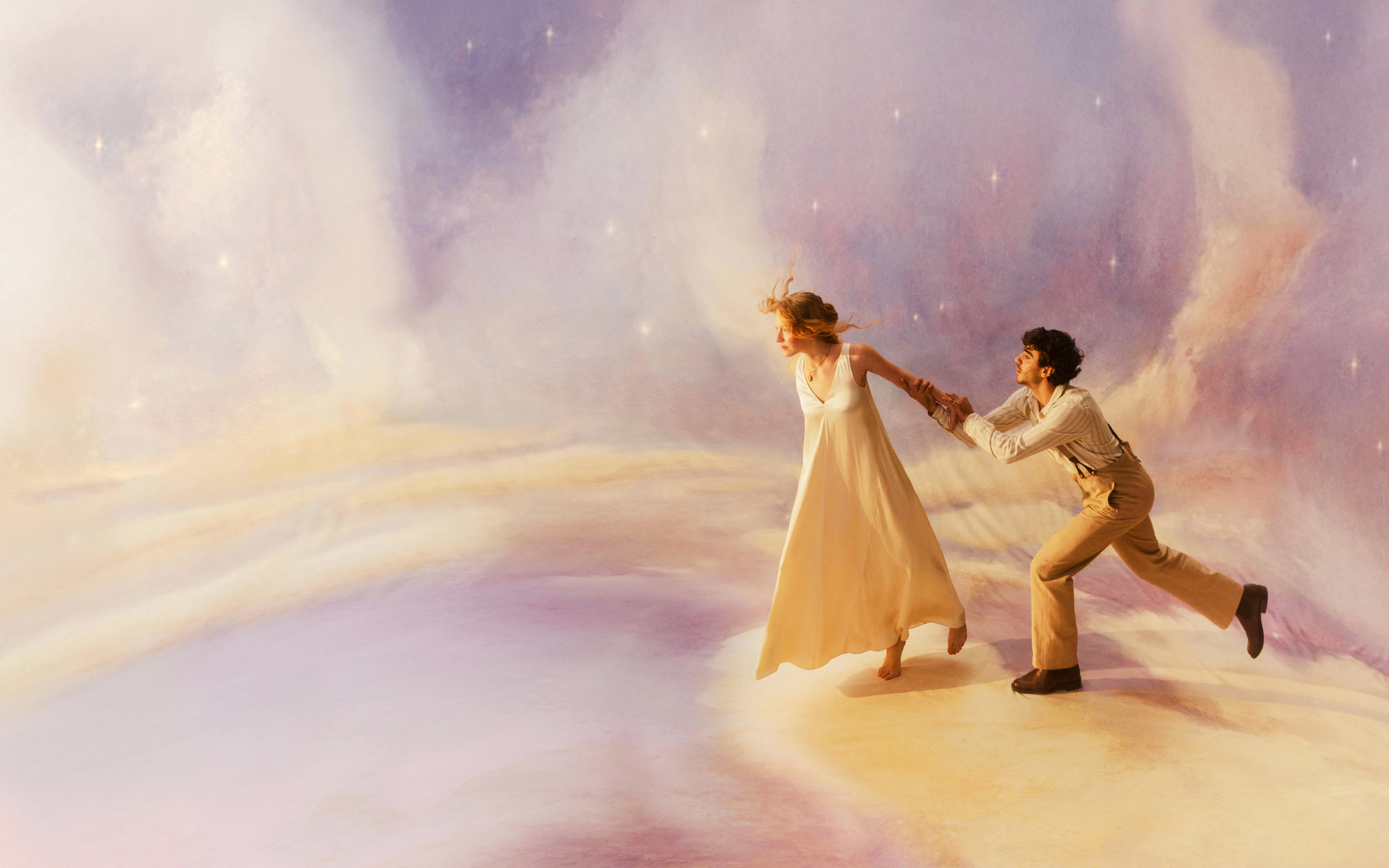 Performers in a scene from La Boheme Opera, Sydney, with a dreamy backdrop.