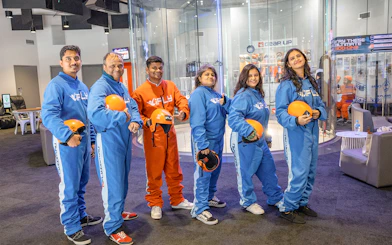 Group in flight suits at iFly Sydney Indoor Skydiving.