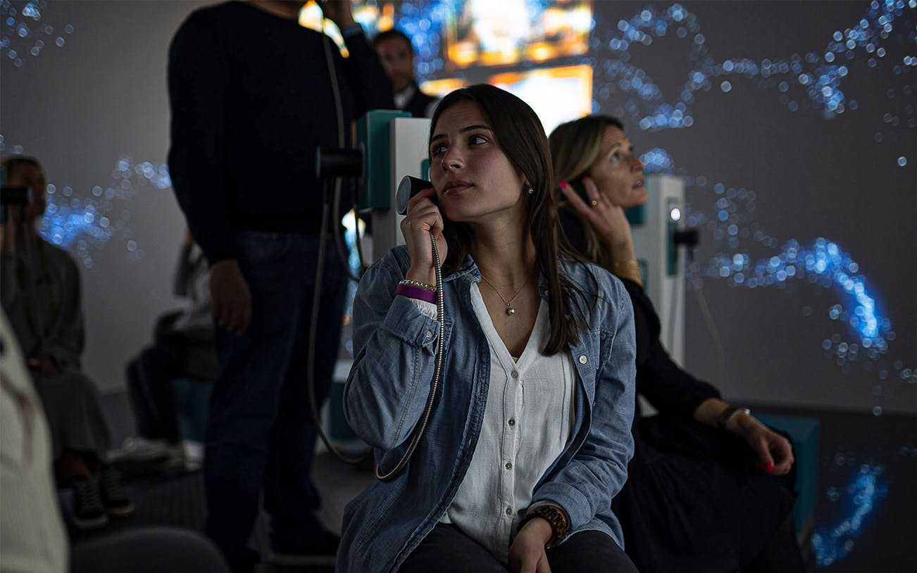Visitors listening to audio guides at QUAKE: Lisbon Earthquake Museum.
