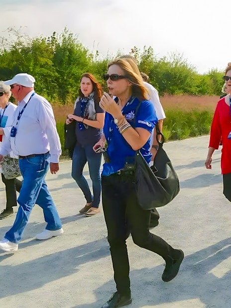 Tour group walking on a path during the D-Day Normandy Beaches guided tour.