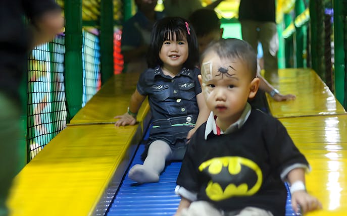 Children playing on a slide at Jungle Gym, Lalaport, Malaysia.