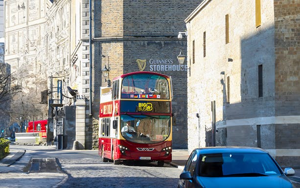 Red double-decker bus near Guinness Storehouse in Dublin.