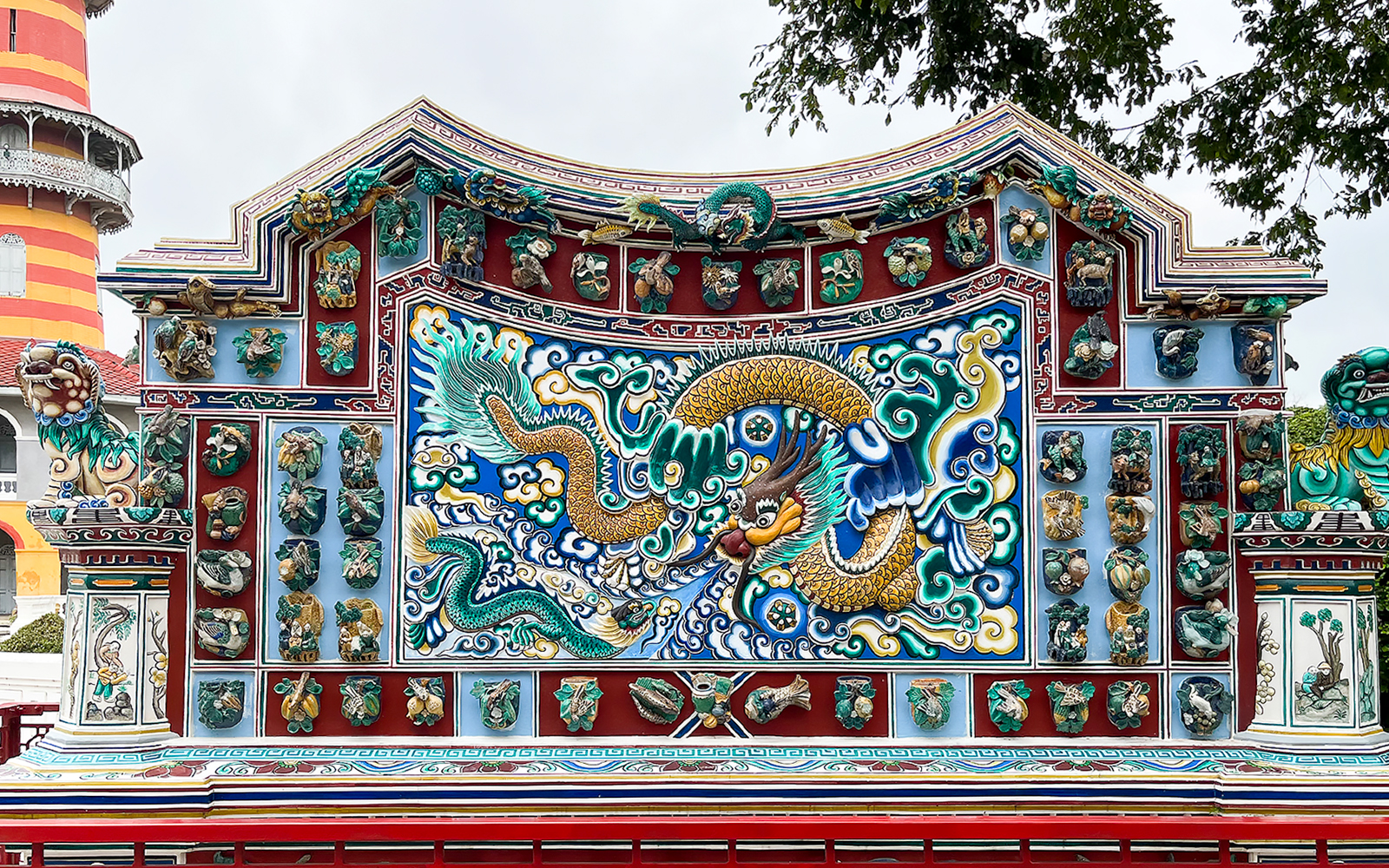 Ornate dragon mosaic at Bang Pa-In Palace, Ayutthaya tour.