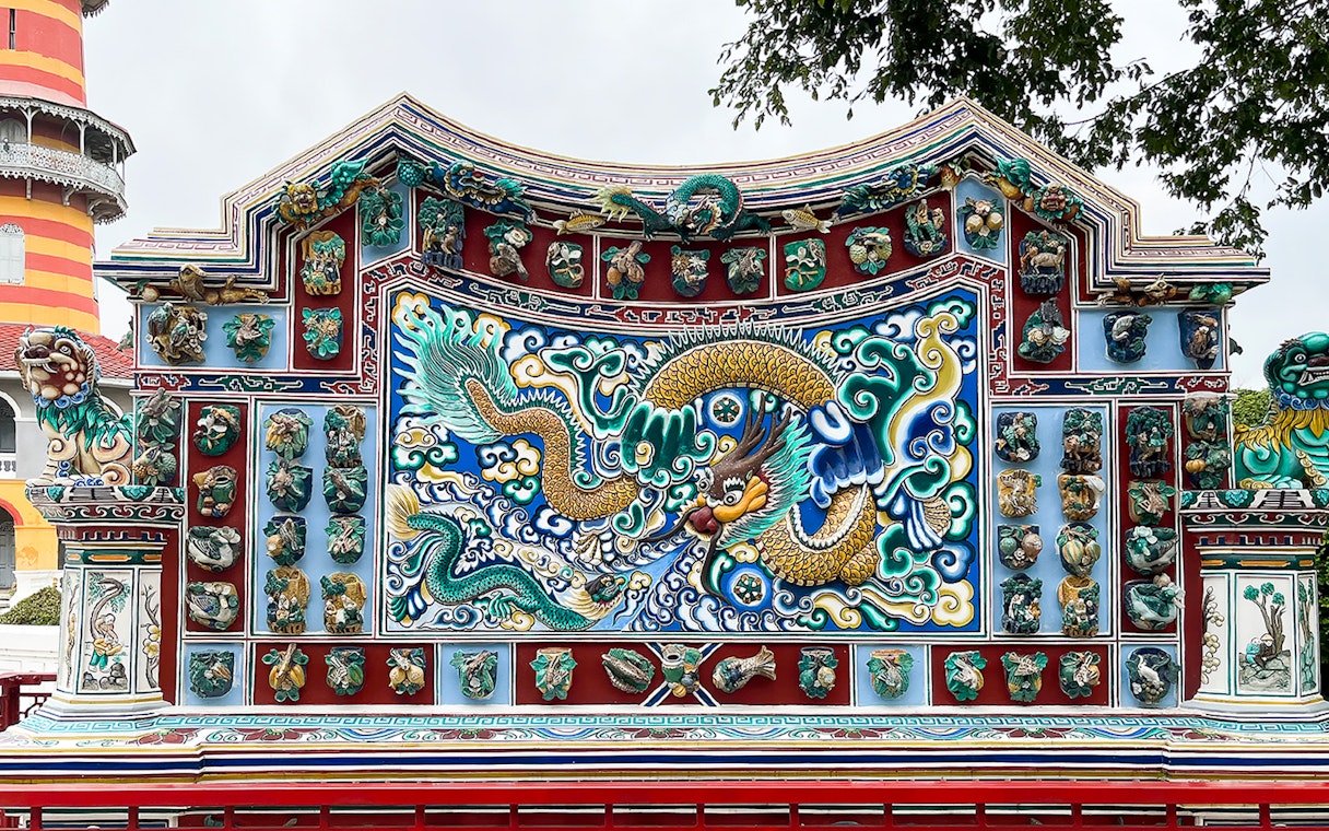 Ornate dragon mosaic at Bang Pa-In Palace, Ayutthaya tour.