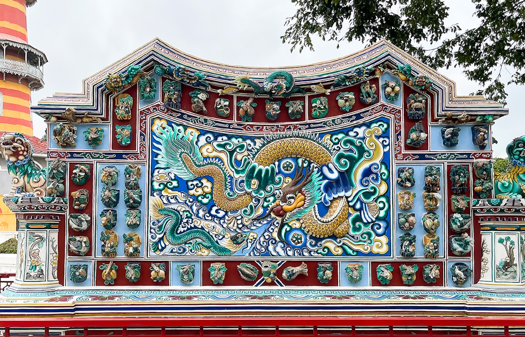 Ornate dragon mosaic at Bang Pa-In Palace, Ayutthaya tour.