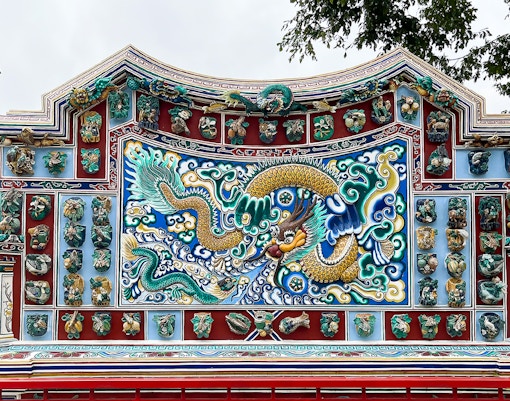 Ornate dragon mosaic at Bang Pa-In Palace, Ayutthaya tour.