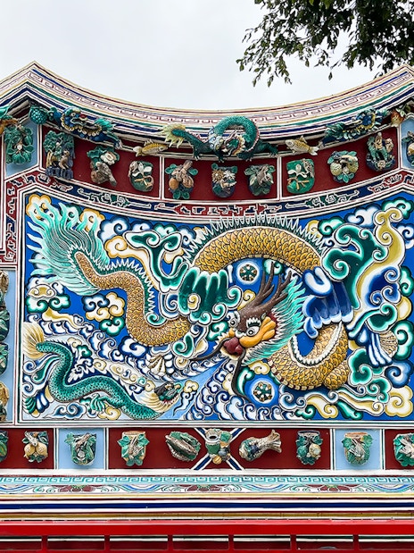 Ornate dragon mosaic at Bang Pa-In Palace, Ayutthaya tour.