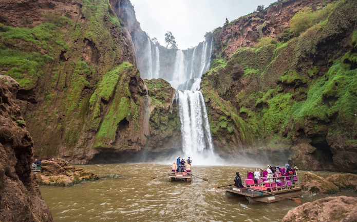 Boat ride approaching Ouzoud waterfalls in Morocco.