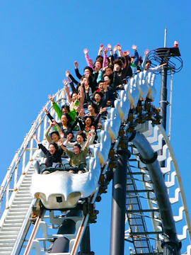 Roller coaster riders with hands up at Fuji-Q Highland, Japan.