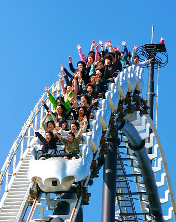 Roller coaster riders with hands up at Fuji-Q Highland, Japan.