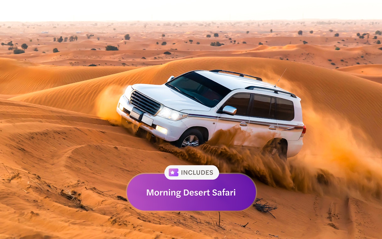 SUV navigating sand dunes on a desert safari in Dubai.