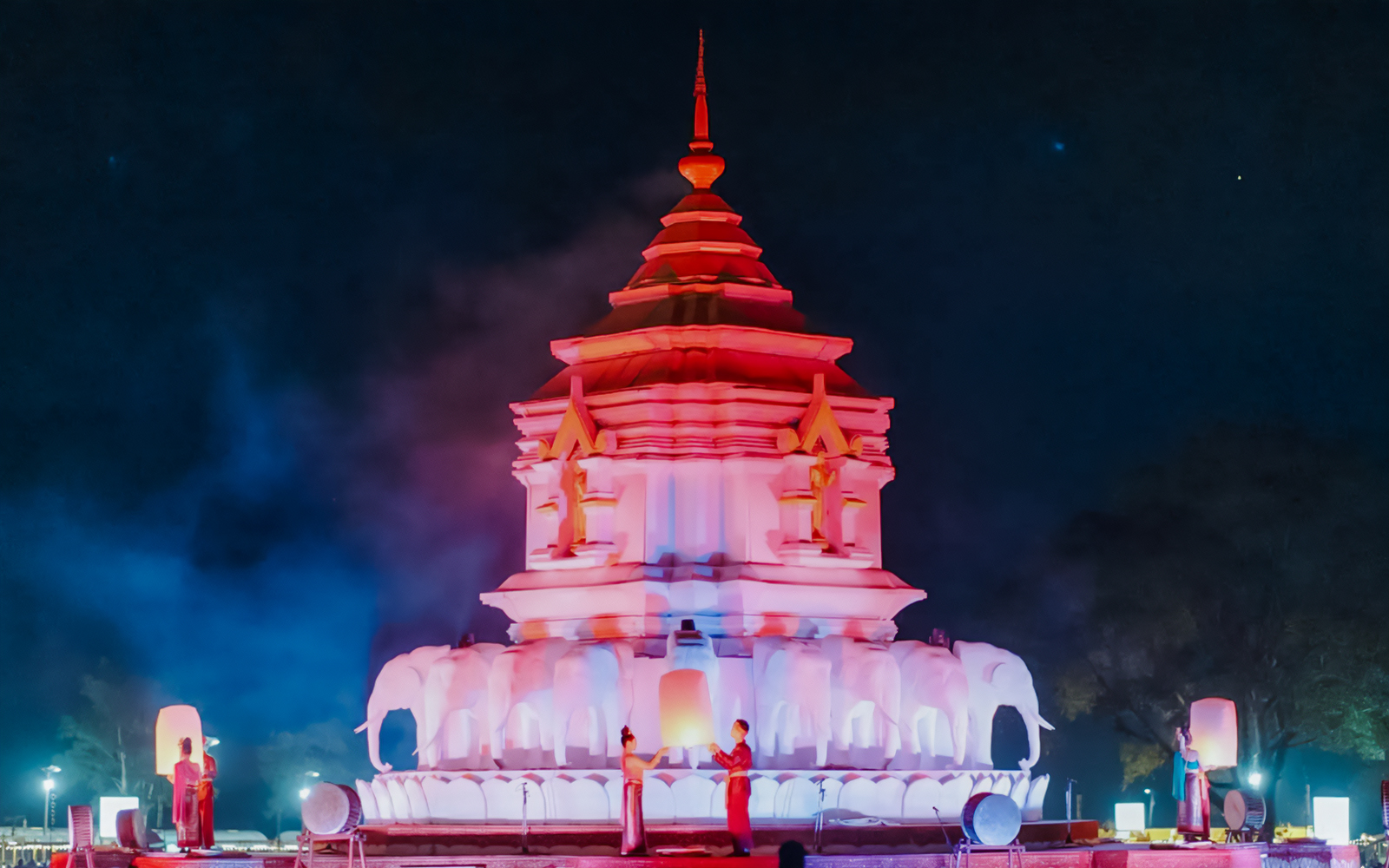 Yipeng Lantern Festival in Chiang Mai with floating lanterns illuminating the night sky.