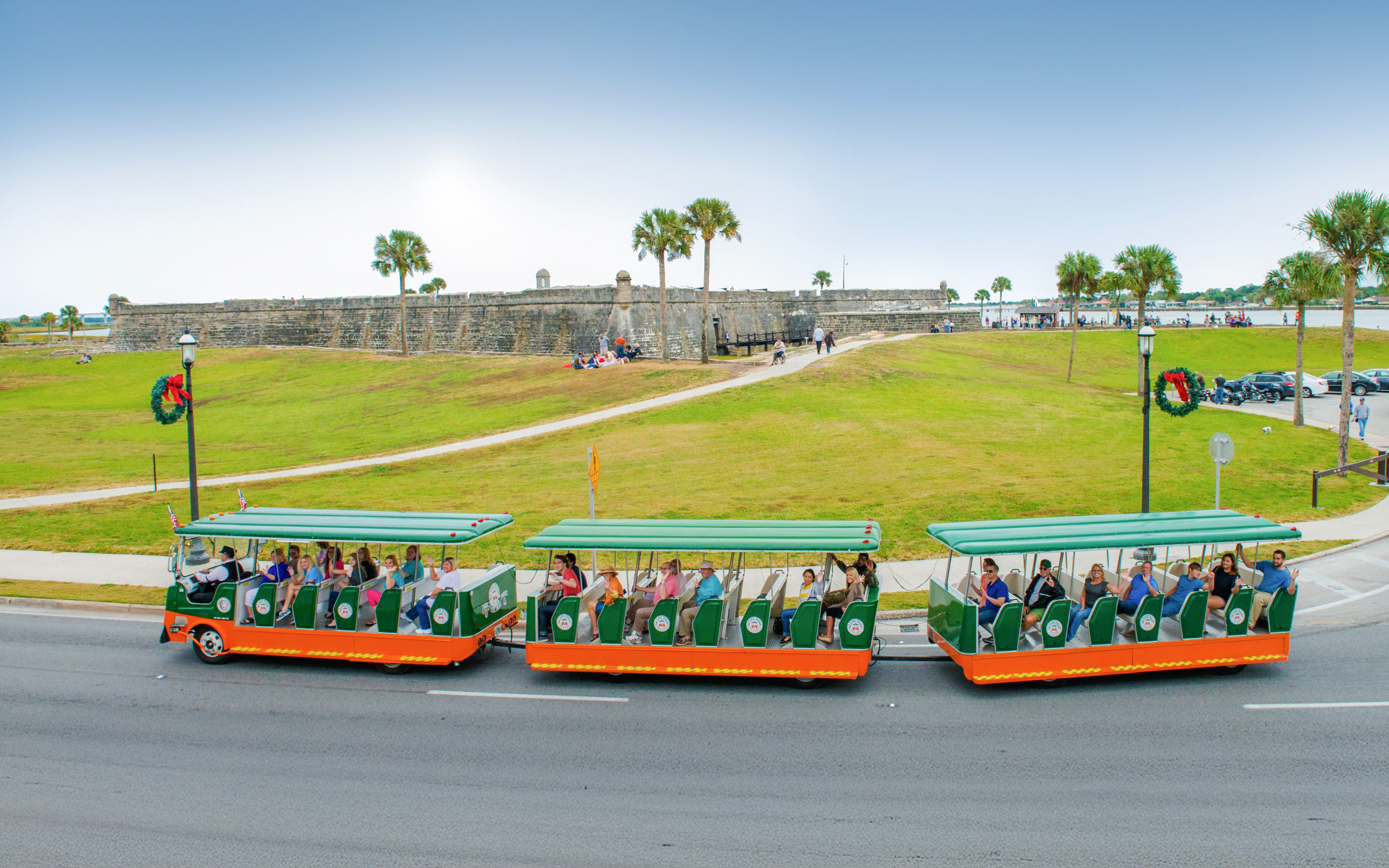 Old Town Trolley tour passing Castillo de San Marcos in St. Augustine.