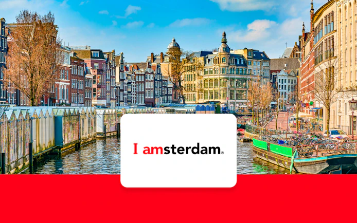 Amsterdam canal with historic buildings and bicycles in early spring.