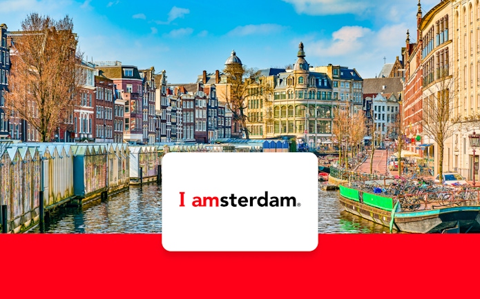 Amsterdam canal with historic buildings and bicycles in early spring.