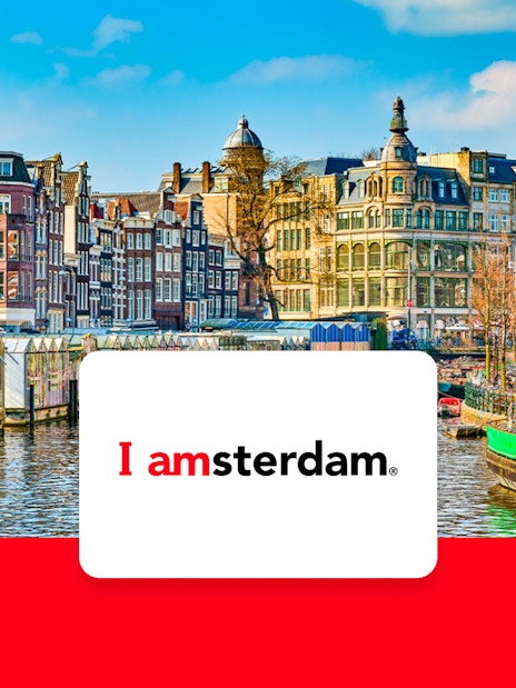 Amsterdam canal with historic buildings and bicycles in early spring.