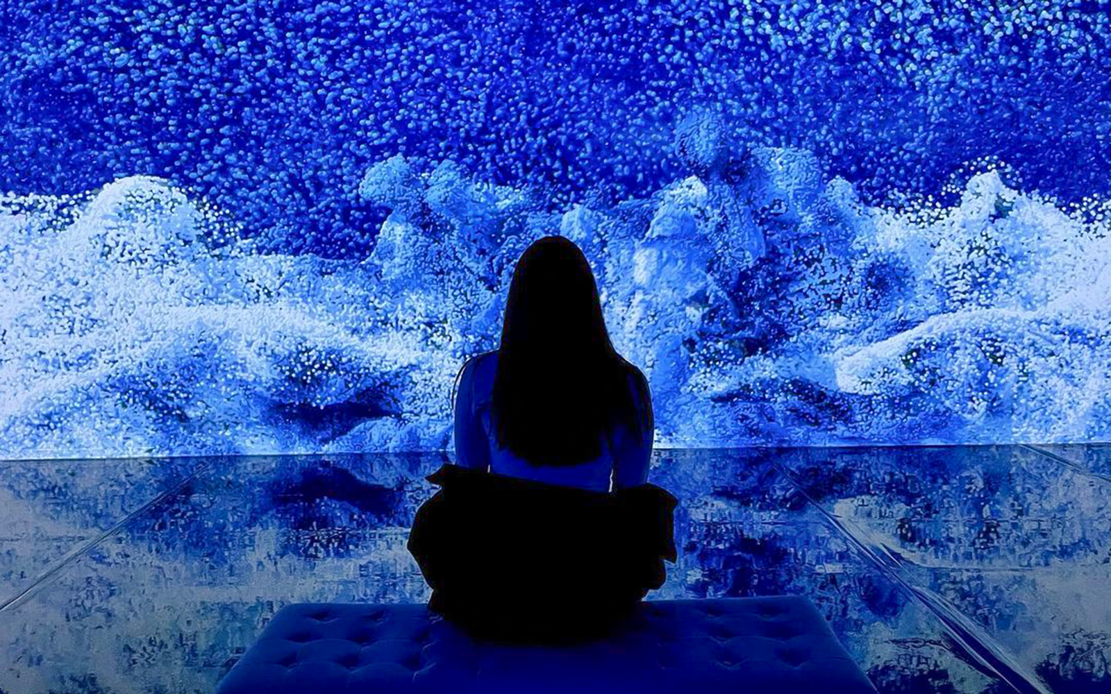 Visitor viewing digital art installation at ARTECHOUSE New York.