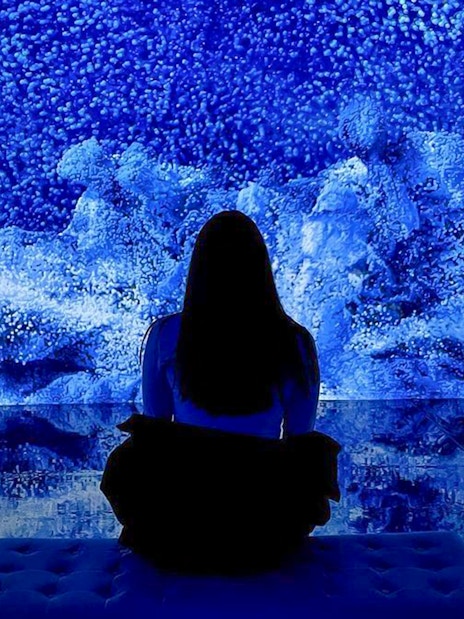 Visitor viewing digital art installation at ARTECHOUSE New York.