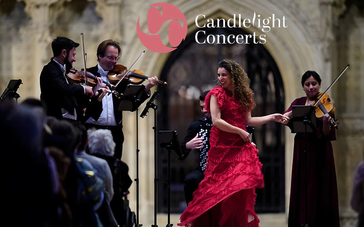 Musicians and a dancer perform at a candlelight opera concert.