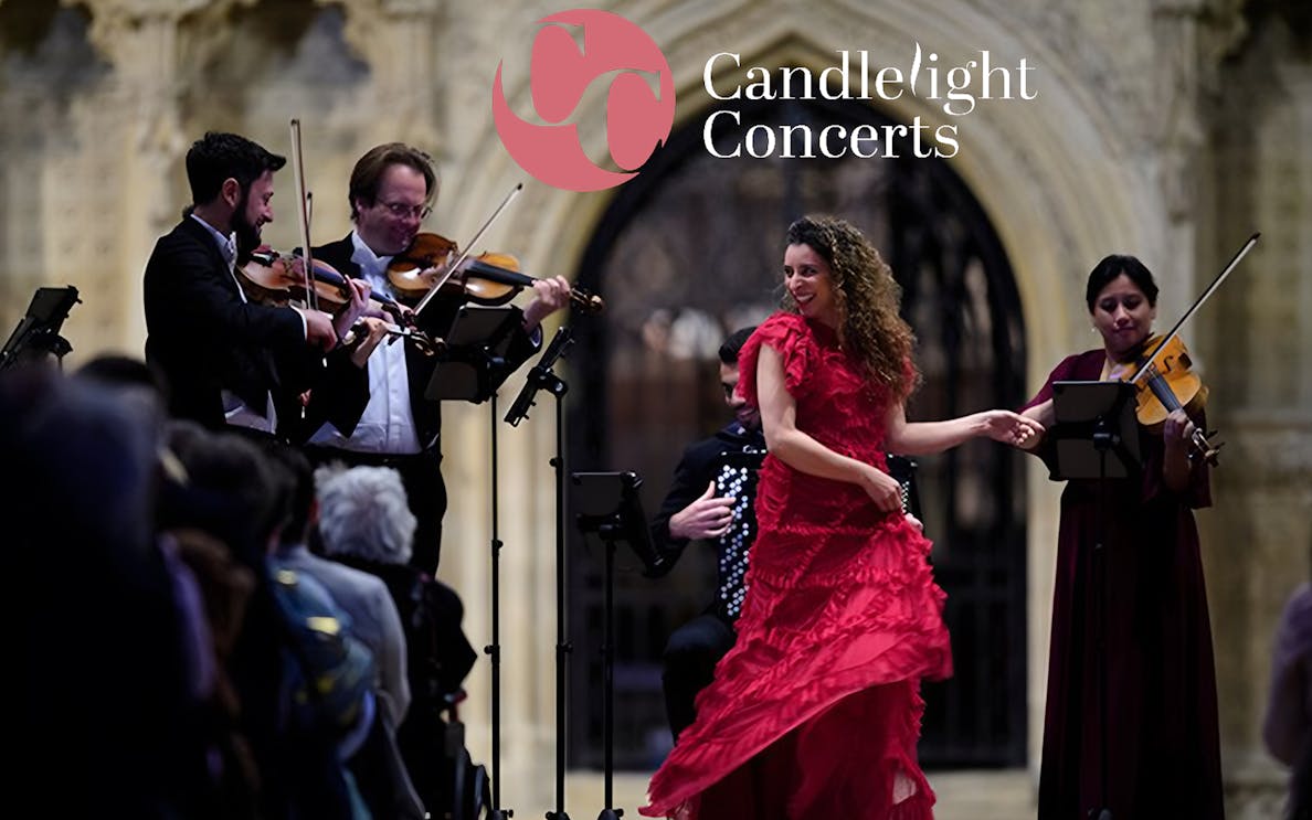 Musicians and a dancer perform at a candlelight opera concert.