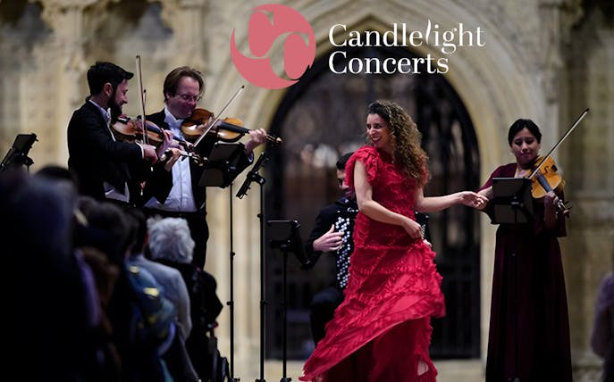 Musicians and a dancer perform at a candlelight opera concert.