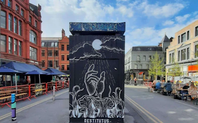 Street art mural in Manchester's Northern Quarter during a self-guided city exploration game.