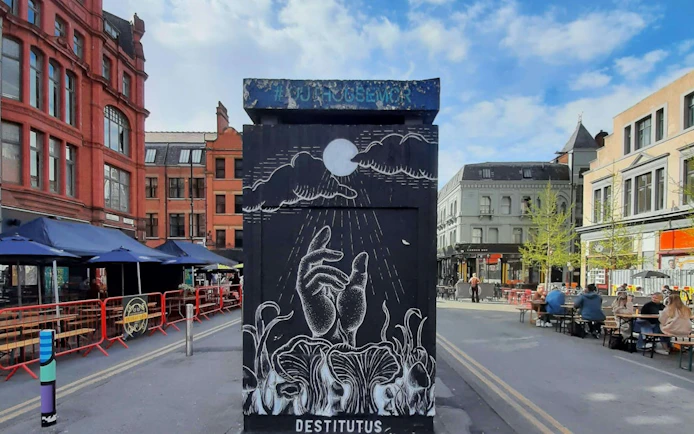 Street art mural in Manchester's Northern Quarter during a self-guided city exploration game.