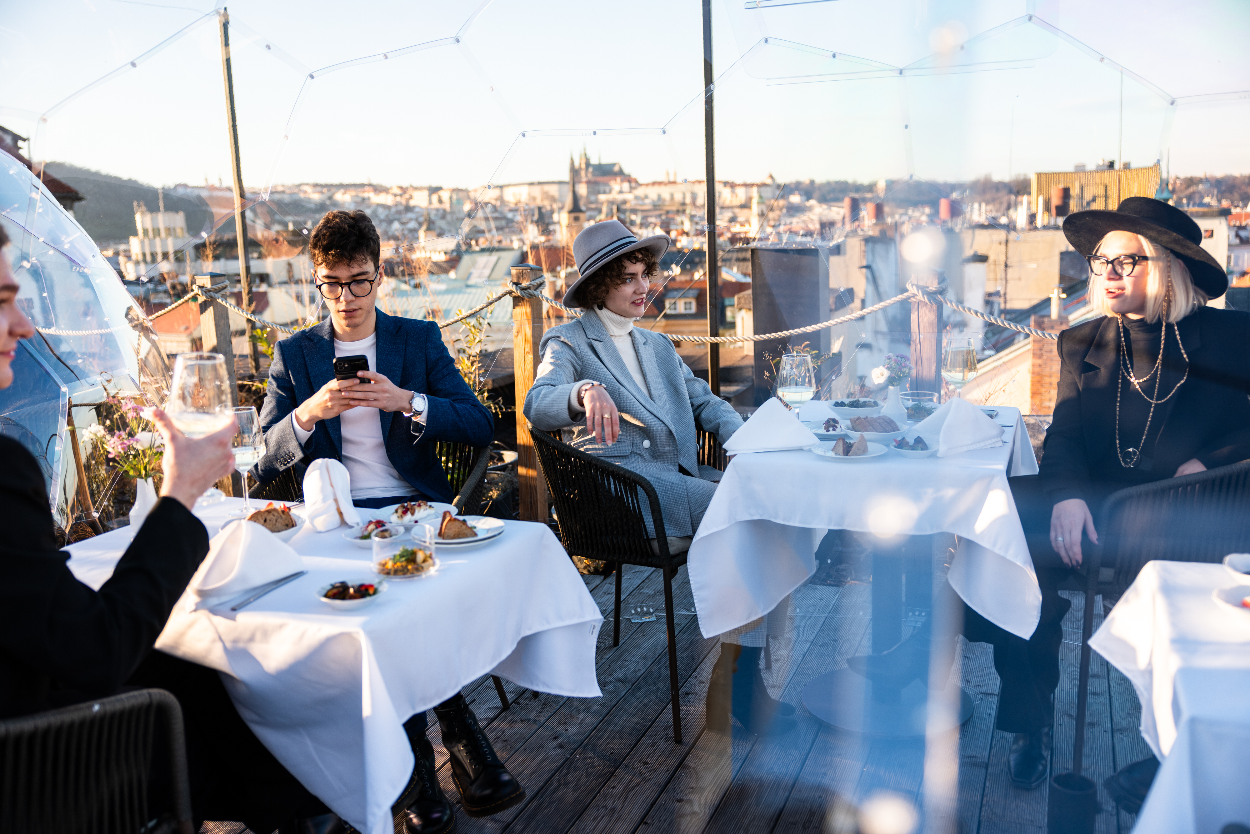 Guests enjoying drinks at Sky Bar Prague with city view during Aperitivo tour.