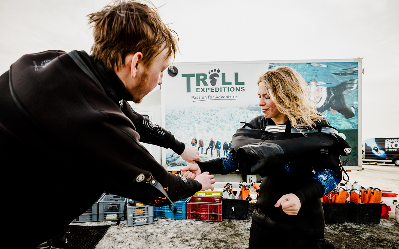 Guests preparing for snorkeling in Silfra Fissure, Iceland, wearing dry suits.