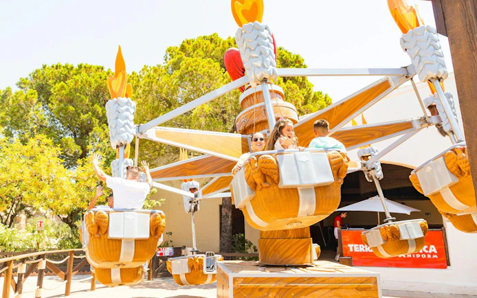 Visitors enjoying a ride at Terra Mitica theme park in Spain.