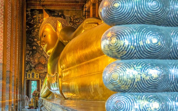 Reclining Buddha statue at Wat Pho temple, Bangkok, Thailand.