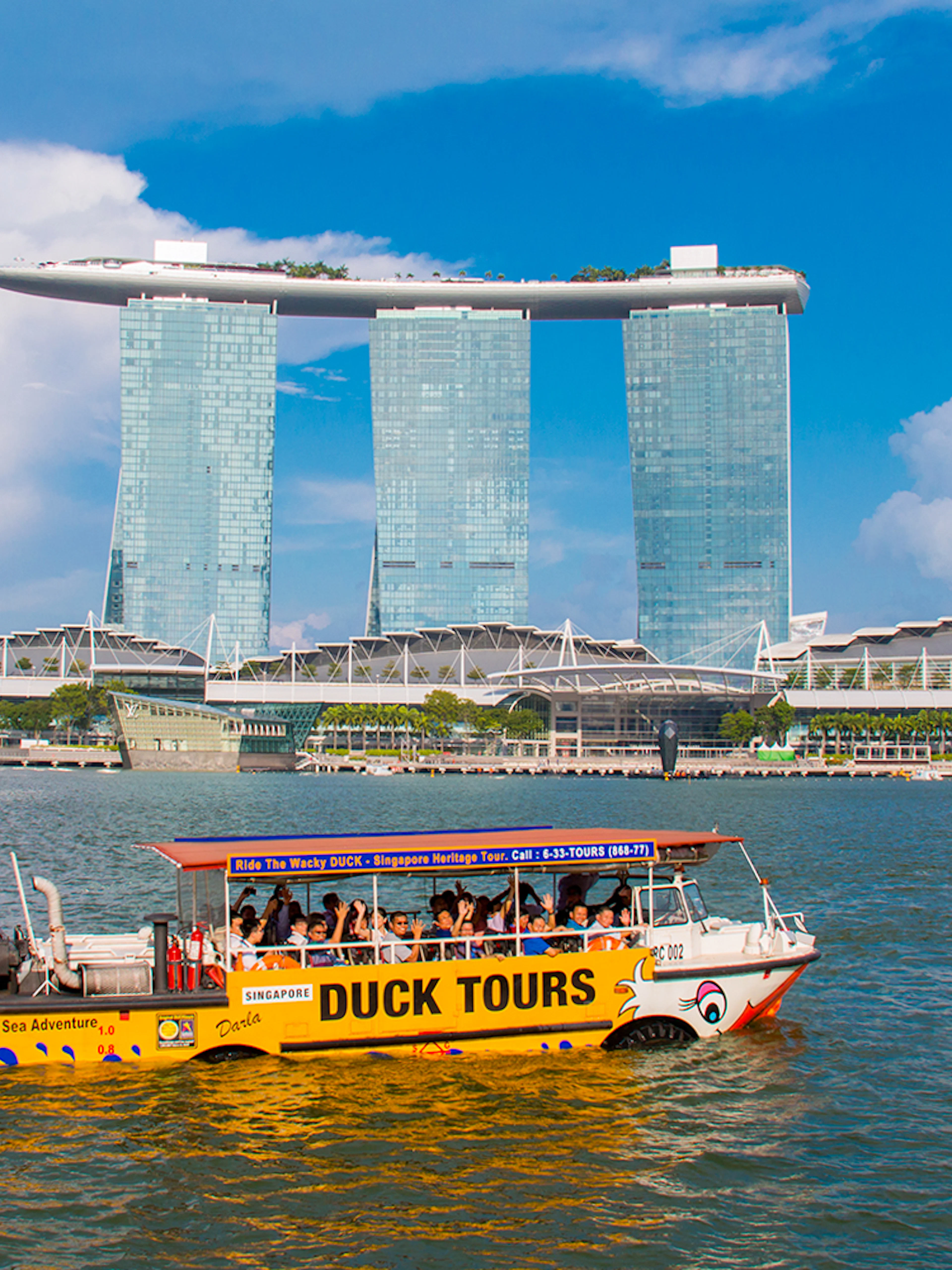 DUCKtours boat on Marina Bay with Marina Bay Sands in Singapore.