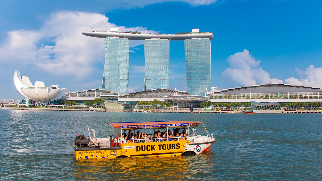 DUCKtours boat on Marina Bay with Marina Bay Sands in Singapore.