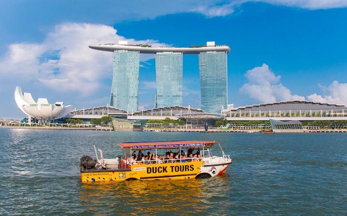 DUCKtours boat on Marina Bay with Marina Bay Sands in Singapore.