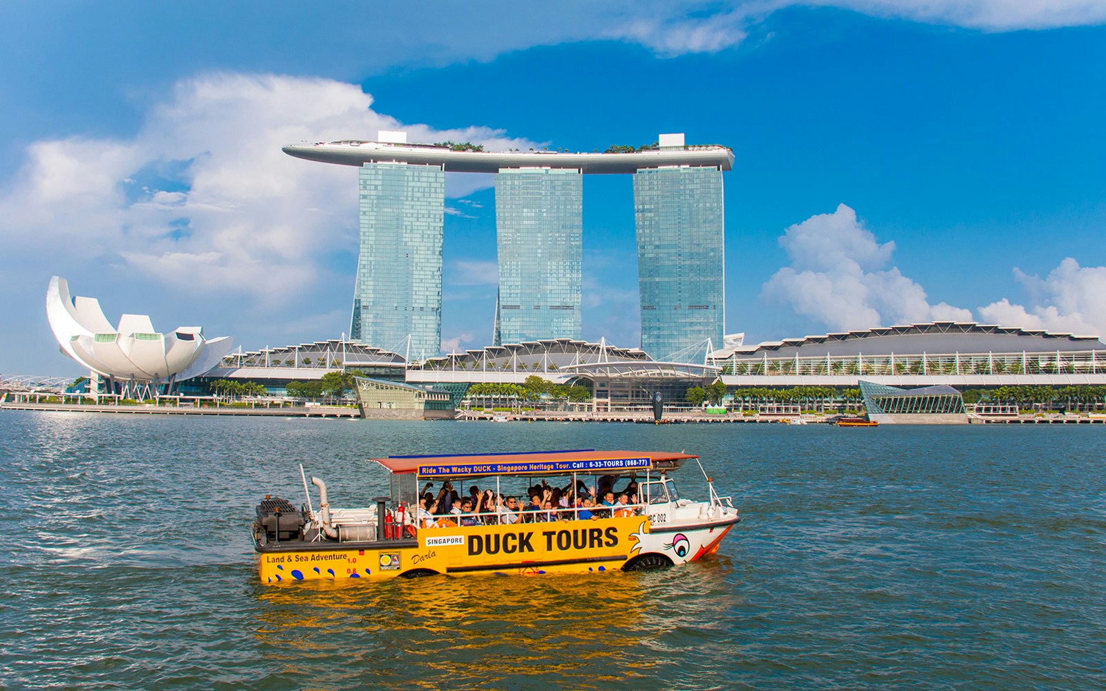 DUCKtours boat on Marina Bay with Marina Bay Sands in Singapore.