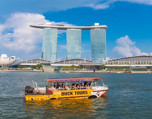DUCKtours boat on Marina Bay with Marina Bay Sands in Singapore.