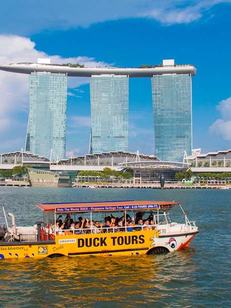DUCKtours boat on Marina Bay with Marina Bay Sands in Singapore.