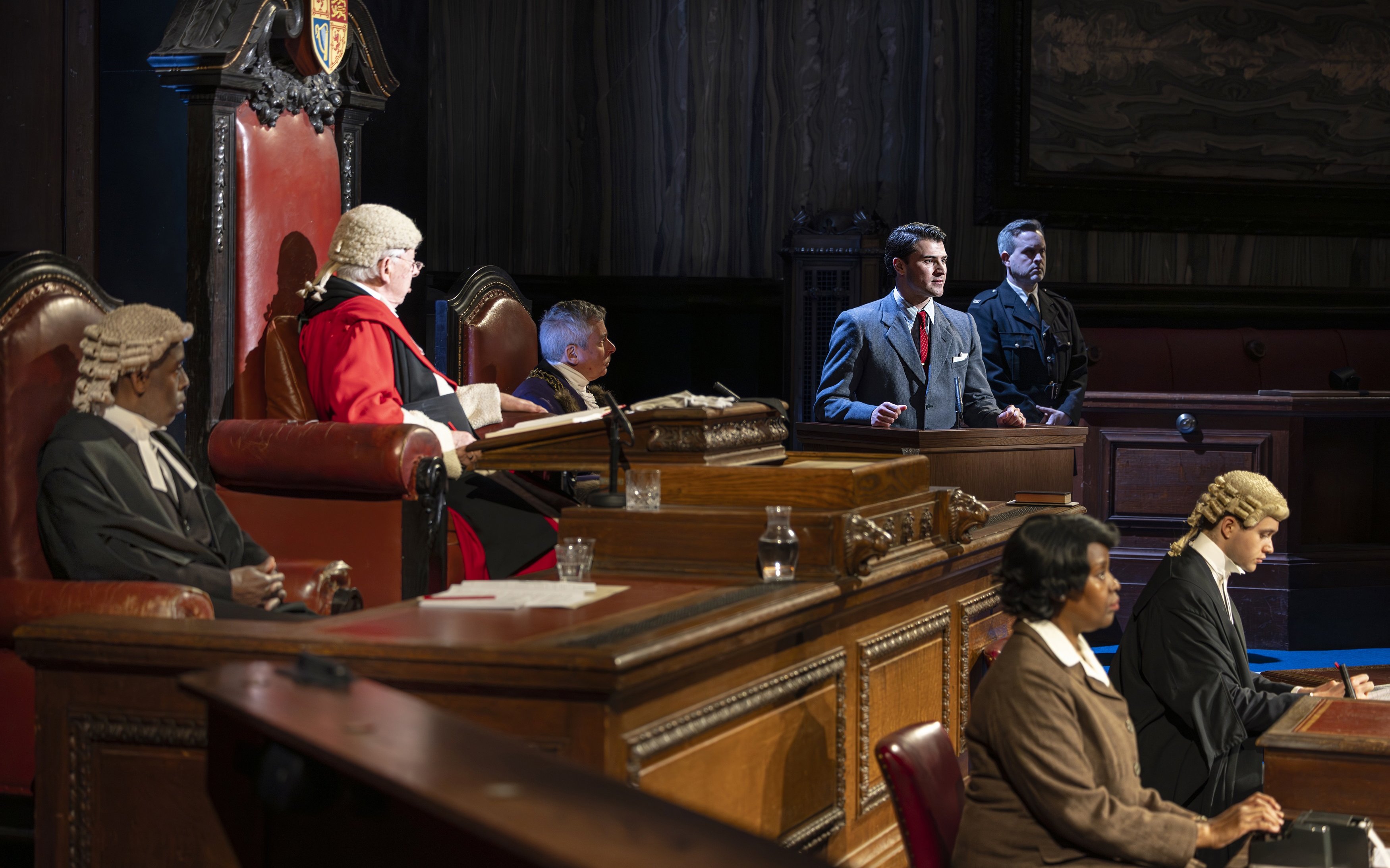 Courtroom scene from "Witness for the Prosecution" performance with actors in legal attire.