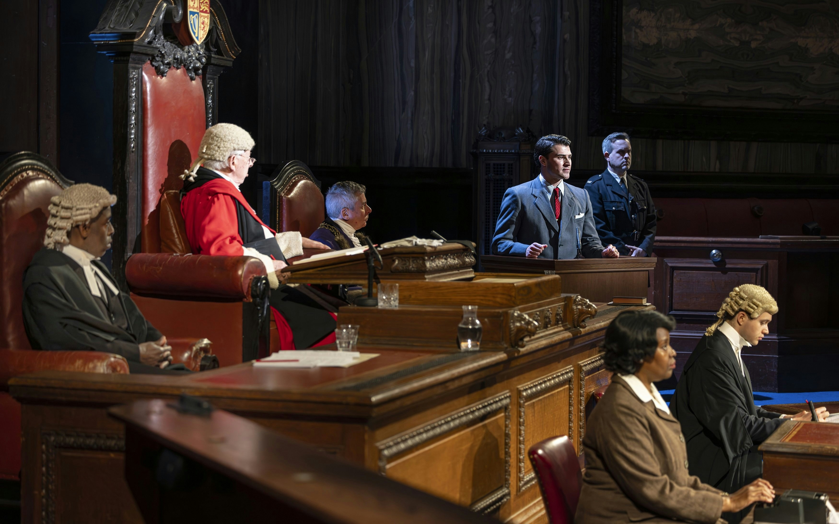 Courtroom scene from "Witness for the Prosecution" performance with actors in legal attire.